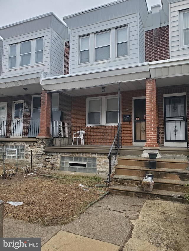 view of property with covered porch