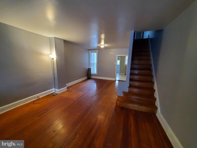 staircase featuring wood-type flooring