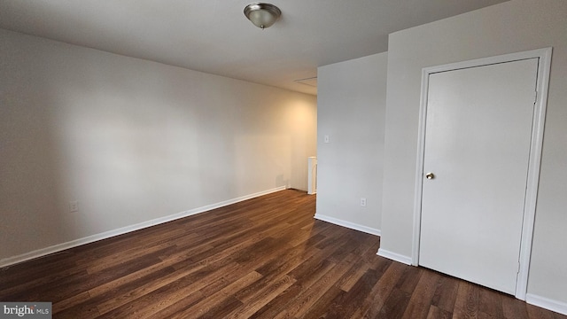 empty room featuring dark hardwood / wood-style floors