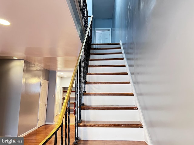 stairs with wood-type flooring