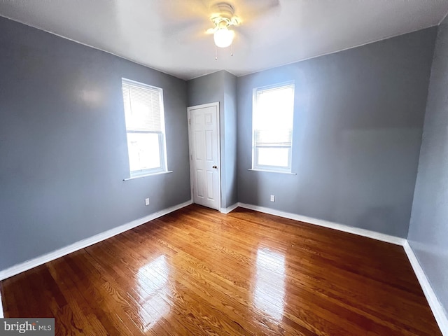 unfurnished bedroom featuring wood-type flooring and ceiling fan