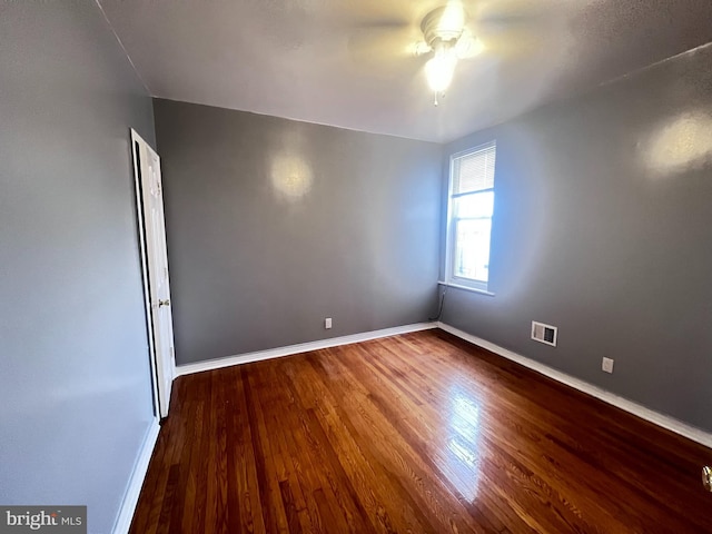 unfurnished room featuring hardwood / wood-style floors