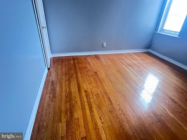 empty room featuring hardwood / wood-style flooring