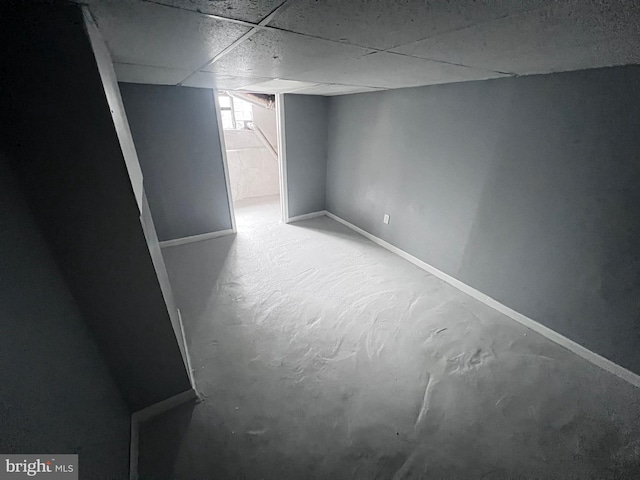 basement featuring a paneled ceiling