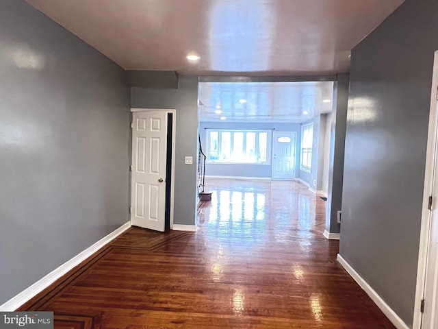 corridor featuring dark hardwood / wood-style floors