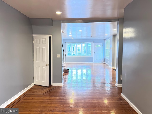 hall with hardwood / wood-style floors