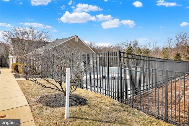 exterior space with a patio area, fence, and a swimming pool