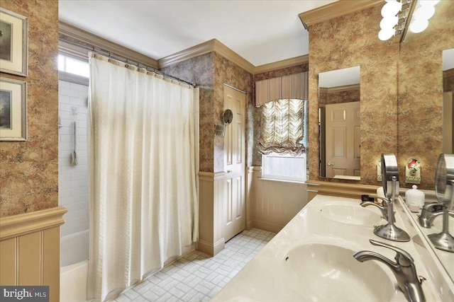 full bath featuring ornamental molding, shower / bath combo, a sink, and double vanity