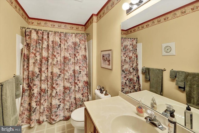 bathroom with toilet, curtained shower, ornamental molding, and vanity