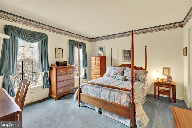 carpeted bedroom with visible vents and baseboards