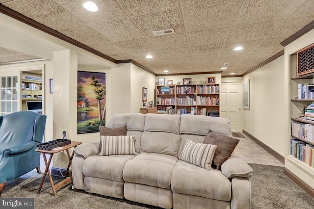 living room featuring baseboards, visible vents, crown molding, and recessed lighting