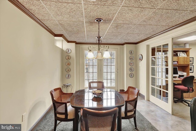 dining space featuring ornamental molding, french doors, and baseboards