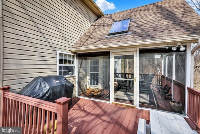 deck with a sunroom