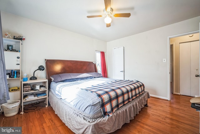 bedroom with wood-type flooring and ceiling fan