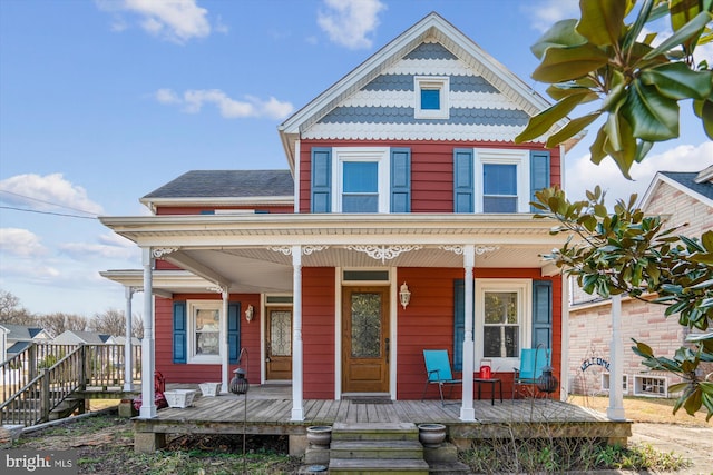 victorian-style house featuring covered porch