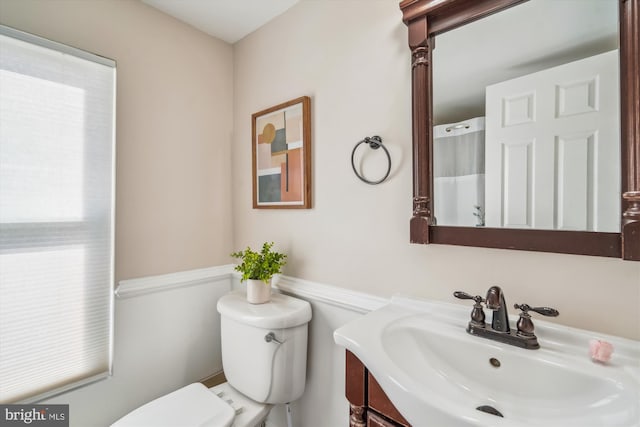 full bathroom featuring vanity and toilet