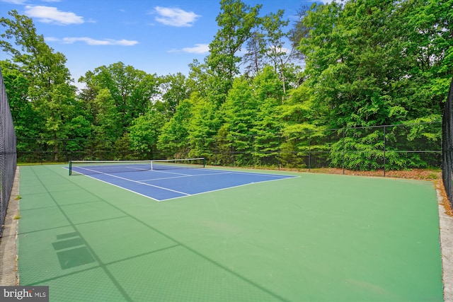 view of sport court with fence