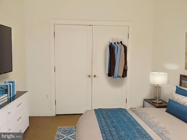 carpeted bedroom featuring a closet