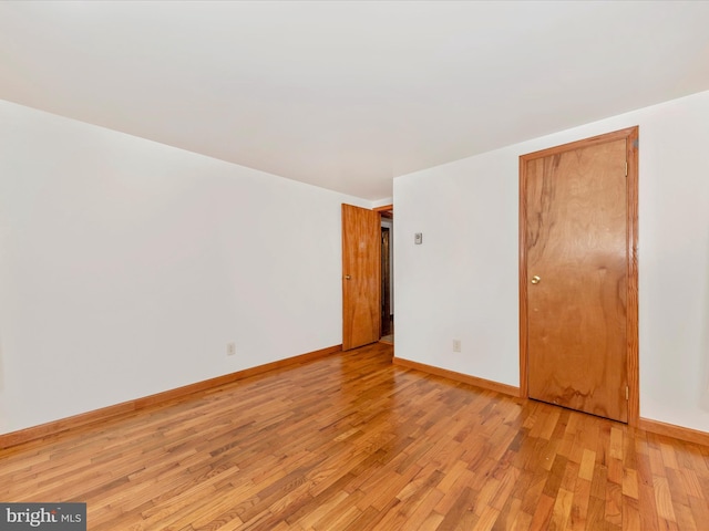 spare room featuring light wood-type flooring