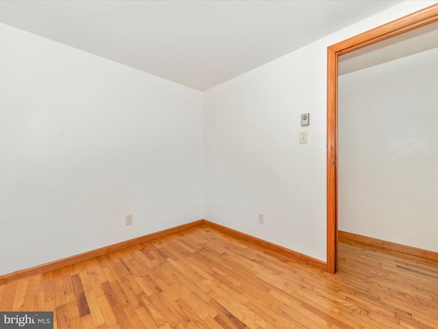 spare room with light hardwood / wood-style flooring