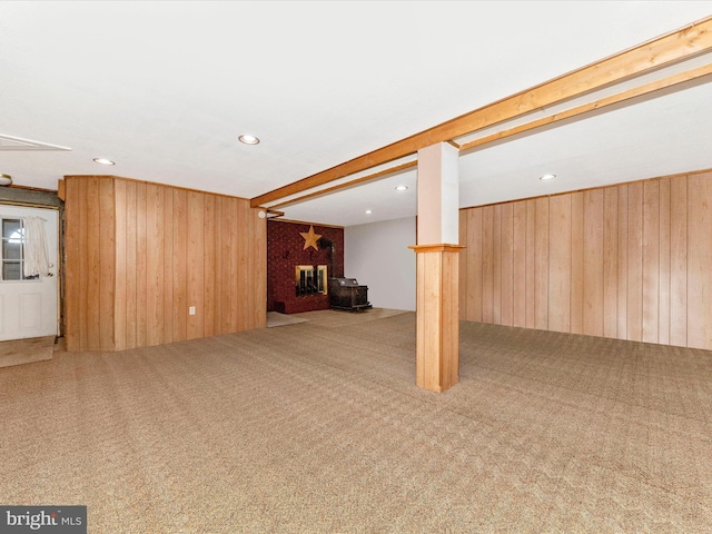 basement with carpet floors and wooden walls