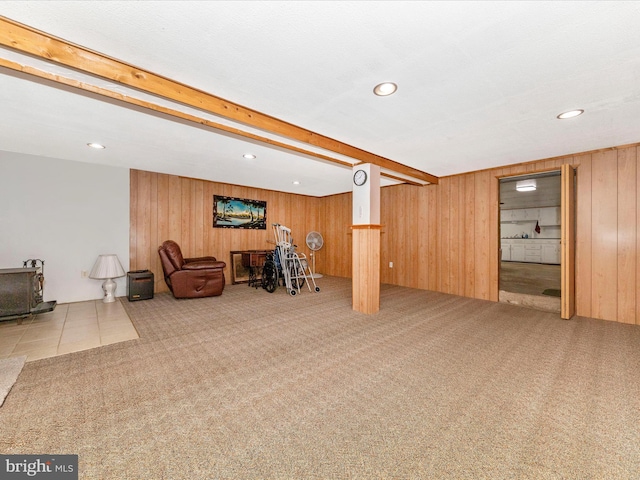 basement with carpet floors and wooden walls