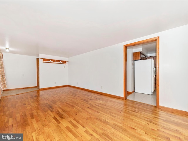 spare room with light hardwood / wood-style flooring