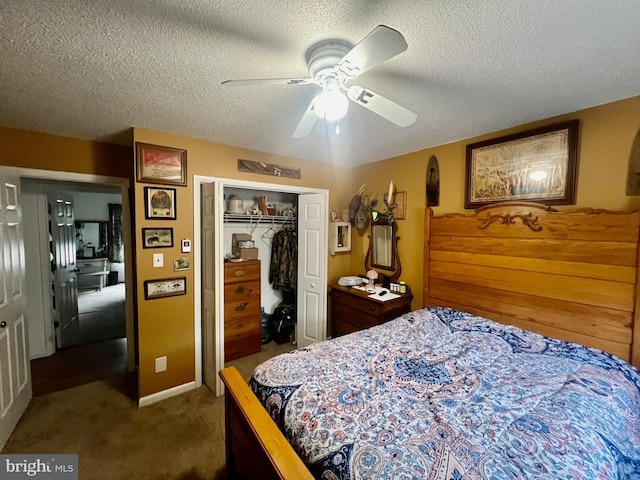 carpeted bedroom with ceiling fan, a closet, and a textured ceiling