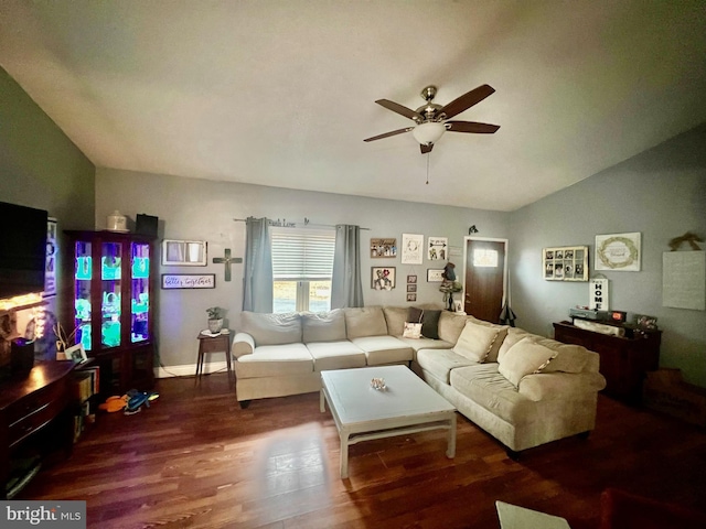 living room featuring hardwood / wood-style flooring, vaulted ceiling, and ceiling fan