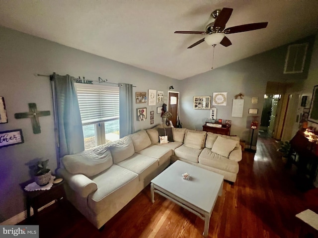 living room with hardwood / wood-style flooring, vaulted ceiling, and ceiling fan