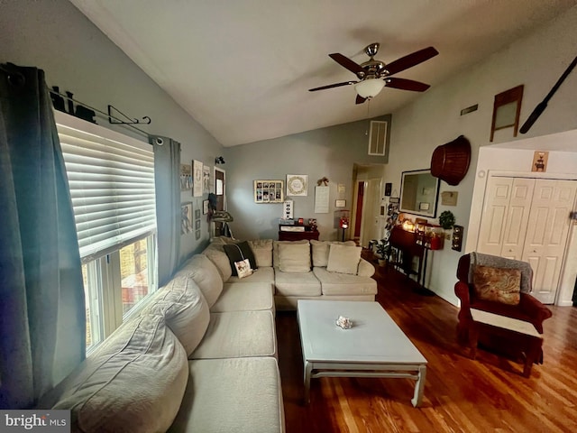 living room featuring ceiling fan, lofted ceiling, and wood-type flooring