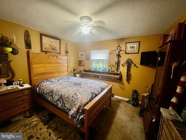 carpeted bedroom featuring ceiling fan and a textured ceiling