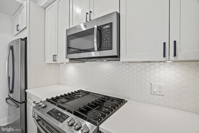 kitchen featuring white cabinetry, appliances with stainless steel finishes, and light countertops