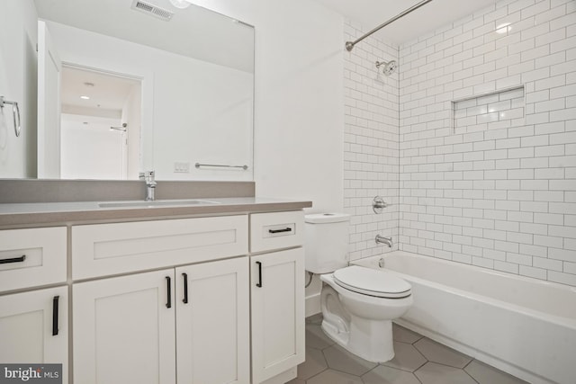 bathroom featuring shower / bath combination, visible vents, toilet, tile patterned flooring, and vanity