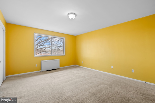 empty room with light colored carpet