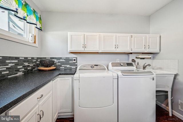 laundry area featuring cabinets and separate washer and dryer