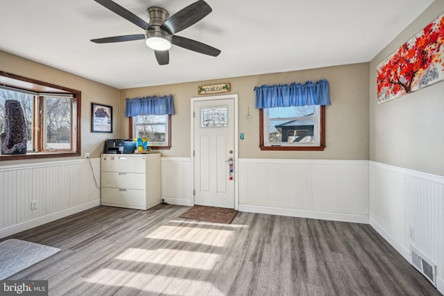 foyer featuring wood-type flooring and ceiling fan