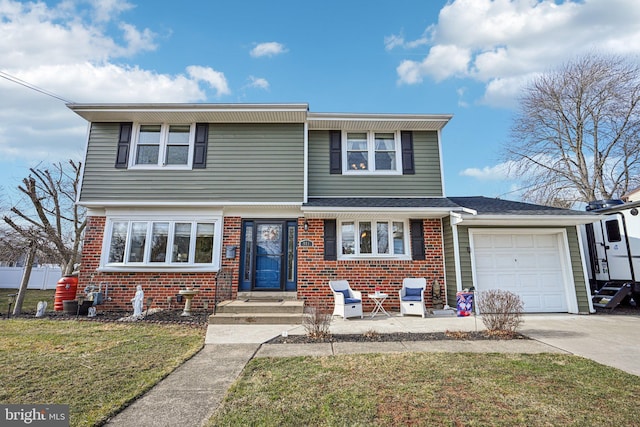 view of front of house with a garage and a front yard