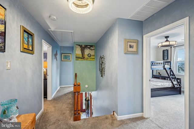 hallway featuring light carpet