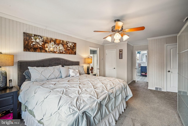 carpeted bedroom featuring ornamental molding and ceiling fan