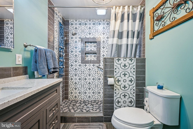 bathroom featuring vanity, toilet, and a shower with shower curtain