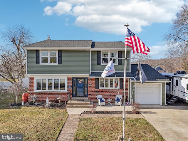 view of front facade with a garage and a front yard