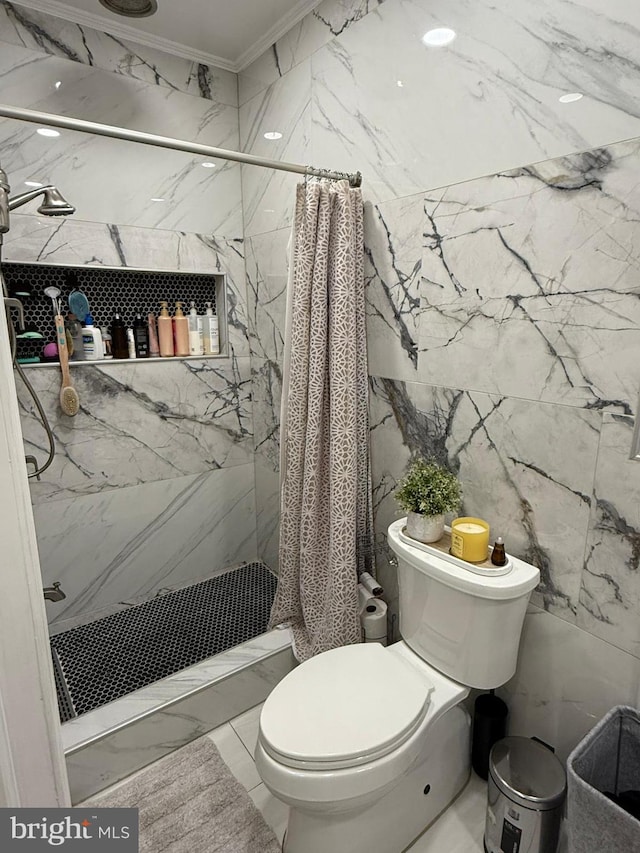 bathroom featuring tile walls, crown molding, toilet, and walk in shower