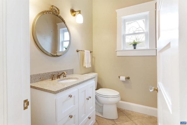 bathroom with vanity, tile patterned floors, and toilet