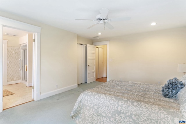 carpeted bedroom featuring connected bathroom, a closet, and ceiling fan