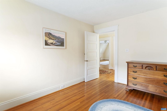 bedroom with hardwood / wood-style floors