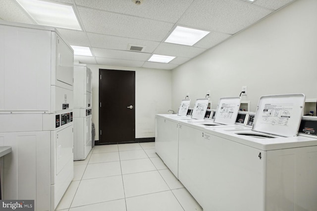 laundry room featuring stacked washer / dryer, separate washer and dryer, and light tile patterned floors