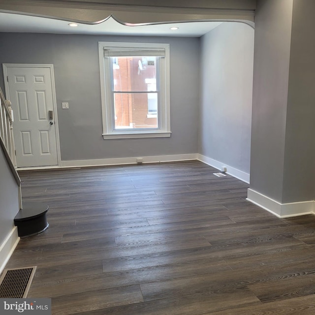 foyer entrance with dark hardwood / wood-style flooring