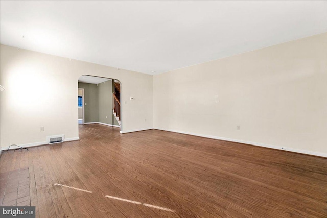 spare room with hardwood / wood-style floors