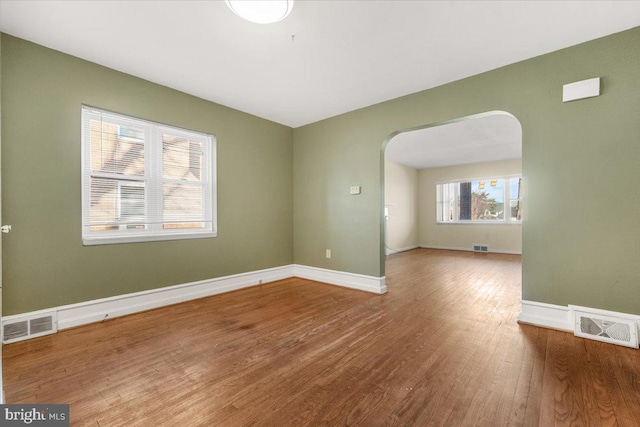 empty room with hardwood / wood-style floors